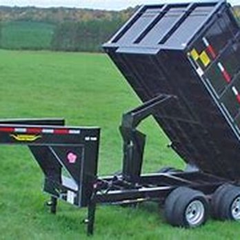 Jarbo Tree Services - a dump trailer in a field - Tree Services Near Me Jarbo Tree Services - a dump trailer in a field - Tree Services Near Me