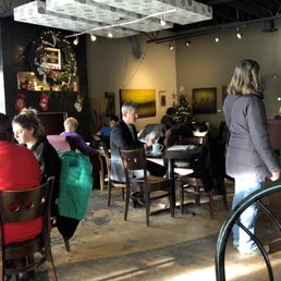 people sitting at tables people sitting at tables