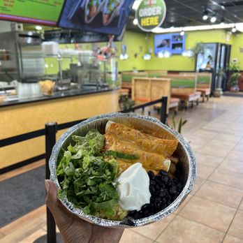 Baja's Restaurant - Glastonbury - a hand holding a bowl of food - Mexican Near Me - Glastonbury, Connecticut Baja's Restaurant - Glastonbury - a hand holding a bowl of food - Mexican Near Me - Glastonbury, Connecticut