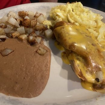 Romero's Las Brazas - Cowboy Plate - pork tamale with potatoes, eggs, and beans. - Mexican Near Me - Houston, Texas Romero's Las Brazas - Cowboy Plate - pork tamale with potatoes, eggs, and beans. - Mexican Near Me - Houston, Texas