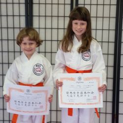 Green's Karate - Two siblings and their orange belts. Congratulations you two! You are moving on up quite nicely! Keep it up!