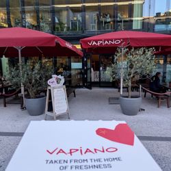 Vapiano - Pizza box in front of exterior of restaurant