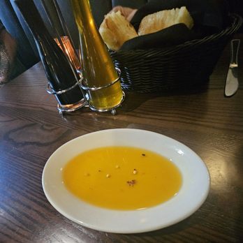Little Mama's - Chili infused oil. Bread in basket - Italian Near Me - Charlotte, North Carolina Little Mama's - Chili infused oil. Bread in basket - Italian Near Me - Charlotte, North Carolina