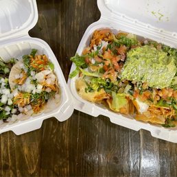 two containers of nachos two containers of nachos
