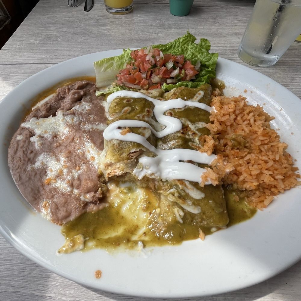 Chicken enchiladas. They were good, as were the rice and beans. Chicken enchiladas. They were good, as were the rice and beans.