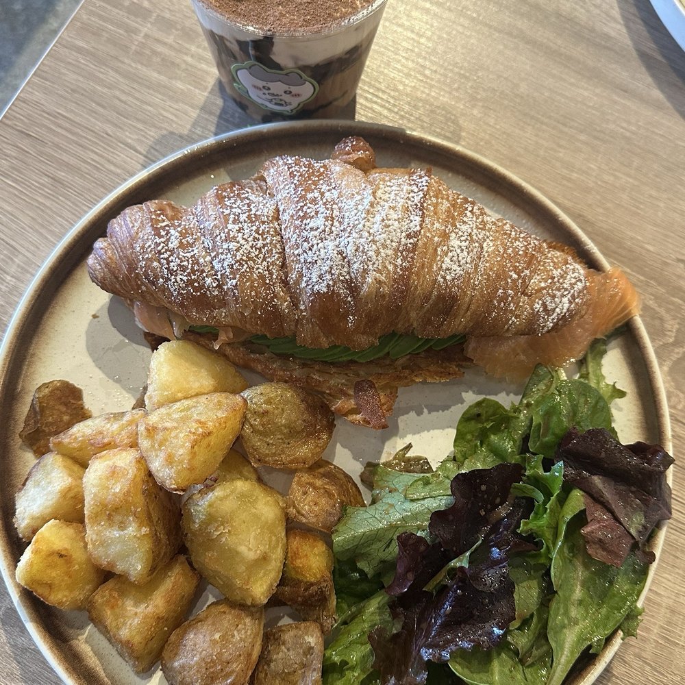 Sunlit Town Brunch Restaurant - Avocado and smoked salmon croissant sandwich with spring mix salad and potatoes - Breakfast & Brunch Near Me - Richmond Hill, Ontario Sunlit Town Brunch Restaurant - Avocado and smoked salmon croissant sandwich with spring mix salad and potatoes - Breakfast & Brunch Near Me - Richmond Hill, Ontario