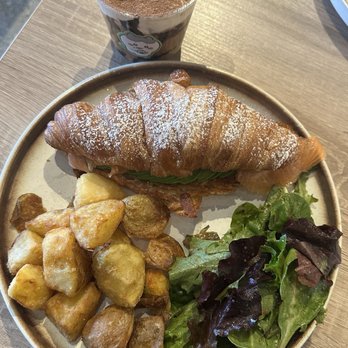Sunlit Town Brunch Restaurant - Avocado and smoked salmon croissant sandwich with spring mix salad and potatoes - Breakfast & Brunch Near Me - Richmond Hill, Ontario