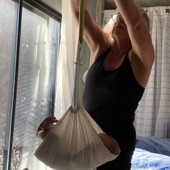 Nancy Greenwood - Nancy using her old school midwifery skills to weigh babe after a safe delivery! - Midwives Near Me - Santa Cruz, California Nancy Greenwood - Nancy using her old school midwifery skills to weigh babe after a safe delivery! - Midwives Near Me - Santa Cruz, California