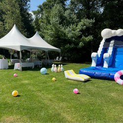 Tent with tables, linens and chairs for a birthday party