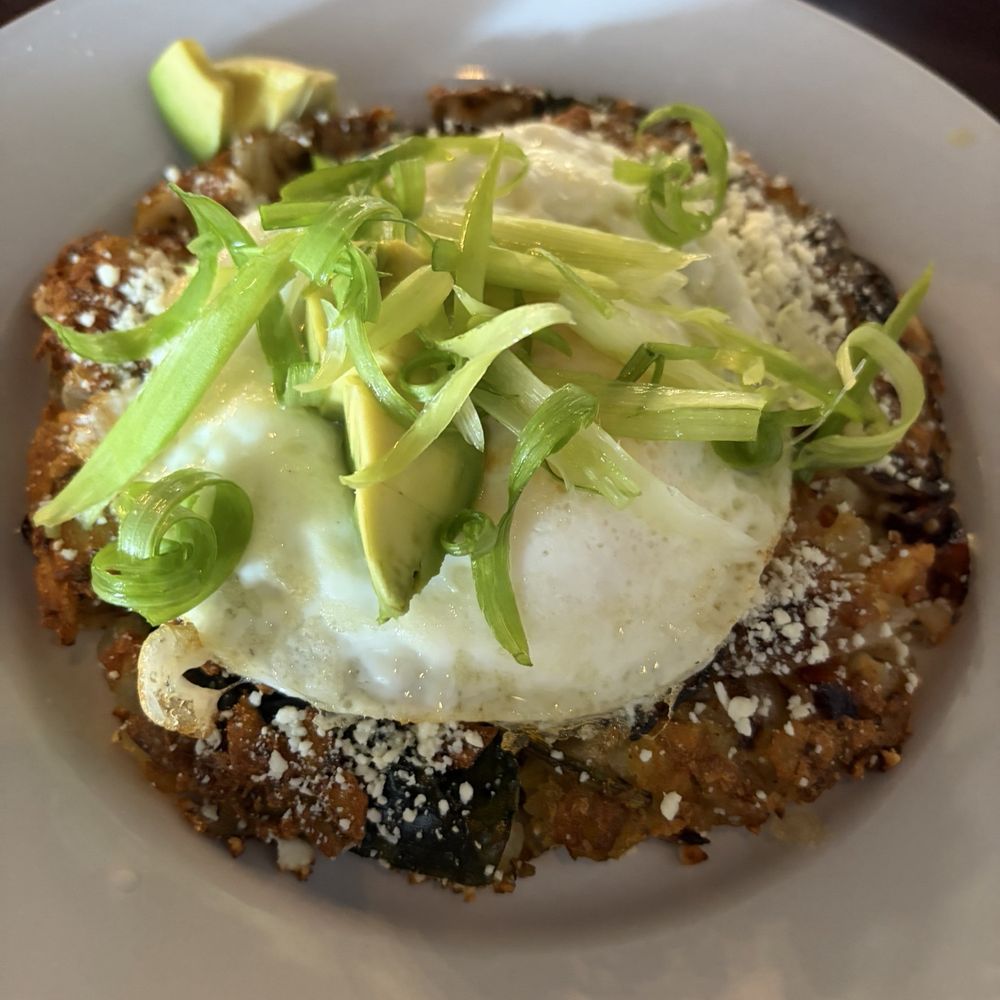 Elliotts an Urban Kitchen - Veggie hash with egg over medium and hot sauce - New American Near Me - Spokane, Washington Elliotts an Urban Kitchen - Veggie hash with egg over medium and hot sauce - New American Near Me - Spokane, Washington