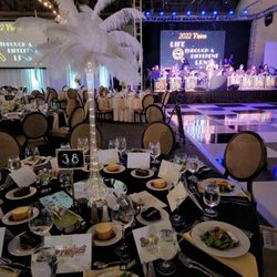 Over The Top Specialty Event Rentals - Feather Tower Centerpeice.