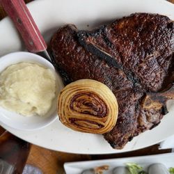 Krapils Steakhouse & Patio - Don't let the photo fool you.  The  steak was not burnt at all. Cooked perfect to medium rare as requested