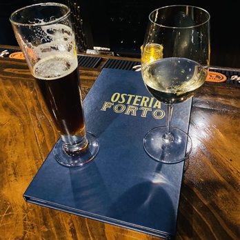 Osteria Forto - two glasses of wine and a menu - Italian Near Me - O'Fallon, Missouri