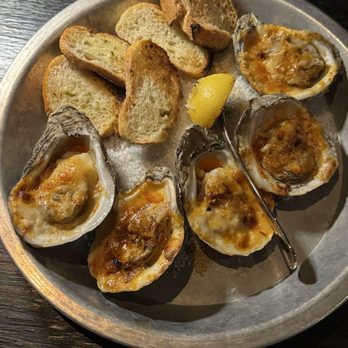 Voodoo Bayou - Wood-Fired Oysters - Chili Butter, Cheese served with Garlic Bread - Cocktail Bars Near Me - Orlando, Florida