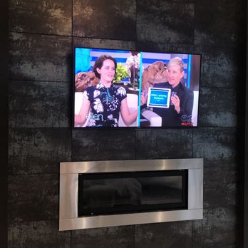 Stream Audio Video - Bedroom TV on tile above a fireplace. Need wiring moved? We're your guys. - Security Systems Near Me Stream Audio Video - Bedroom TV on tile above a fireplace. Need wiring moved? We're your guys. - Security Systems Near Me
