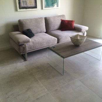 Stonehouse - a couch and coffee table in a living room - Tiling Near Me - Cathedral City, California Stonehouse - a couch and coffee table in a living room - Tiling Near Me - Cathedral City, California