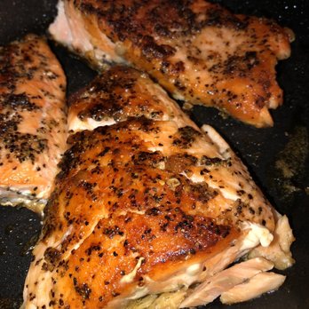 ALDI - three pieces of salmon cooking in a skillet - Grocery Near Me - Fountain Valley, California ALDI - three pieces of salmon cooking in a skillet - Grocery Near Me - Fountain Valley, California