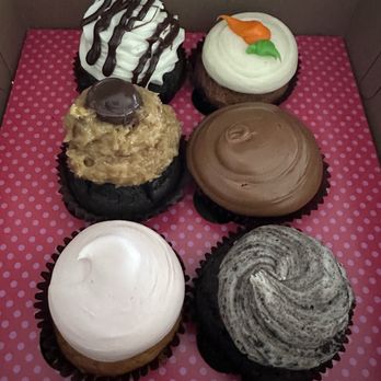 Smallcakes Cave Creek - So pretty in that hot pink bakery box. My favorite were the carrot cake and pink vanilla. They were the right amount of sweet for me. - Cupcakes Near Me - Cave Creek, Arizona