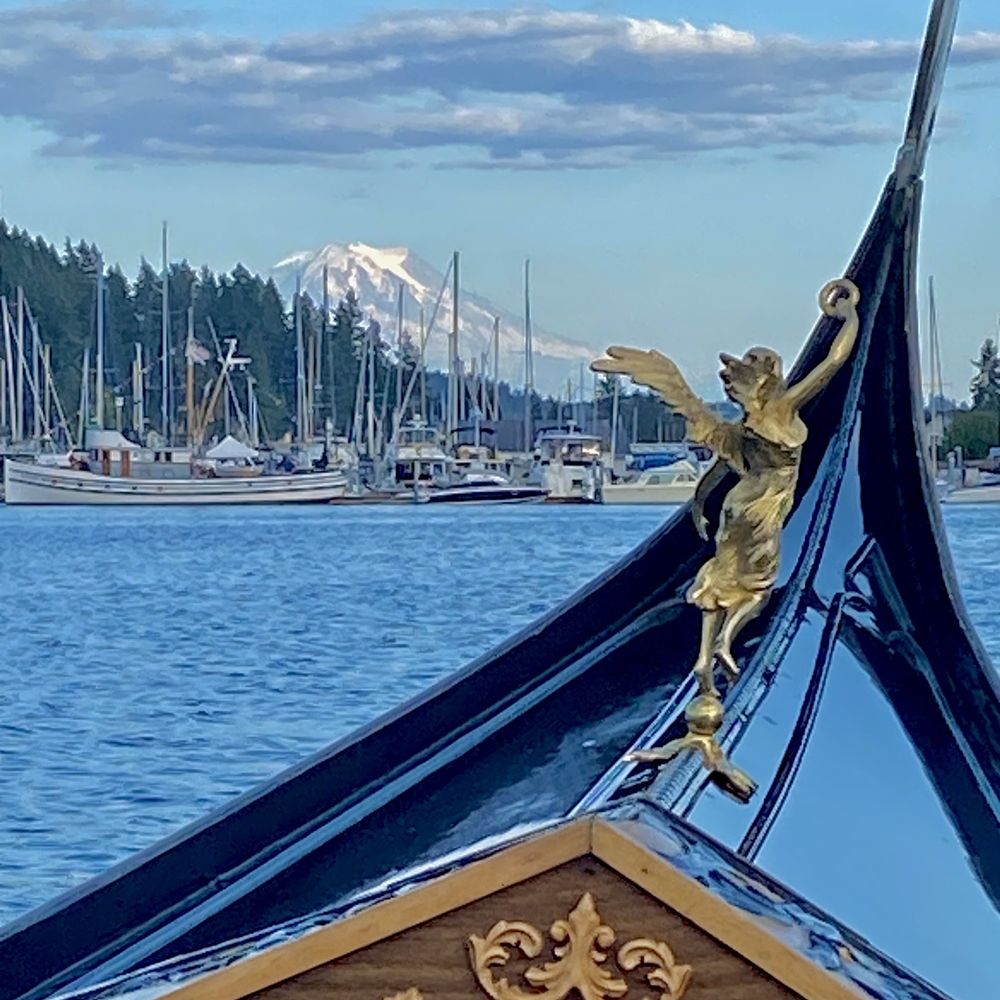 Gig Harbor Gondola - What a great shot w/ Mt. Rainier in background on beautiful summer evening. - Boat Tours Near Me - Gig Harbor, Washington Gig Harbor Gondola - What a great shot w/ Mt. Rainier in background on beautiful summer evening. - Boat Tours Near Me - Gig Harbor, Washington