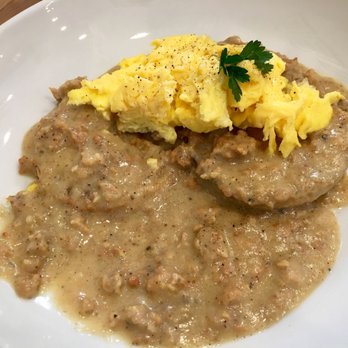 Petit Chou - Buttermilk biscuits with chicken sausage gravy and scrambled eggs with cheese - Breakfast & Brunch Near Me - Atlanta, Georgia Petit Chou - Buttermilk biscuits with chicken sausage gravy and scrambled eggs with cheese - Breakfast & Brunch Near Me - Atlanta, Georgia