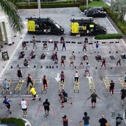 OutFit Training - Drone footage: workout equipment to train up to 100 participants per van. Fully loaded with an entire boutique gym on wheels!