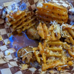 a plate of waffles and french fries a plate of waffles and french fries