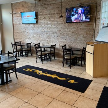 Skidoe's Cafe and Grill - Cozy intimate seating with TVs - Soul Food Near Me - Chicago, Illinois Skidoe's Cafe and Grill - Cozy intimate seating with TVs - Soul Food Near Me - Chicago, Illinois