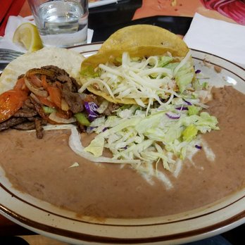 Delicias Cafe - The taco plate: carne asada, chicken and beef tacos served with double beans and a "salad" - Mexican Near Me - Albuquerque, New Mexico Delicias Cafe - The taco plate: carne asada, chicken and beef tacos served with double beans and a "salad" - Mexican Near Me - Albuquerque, New Mexico