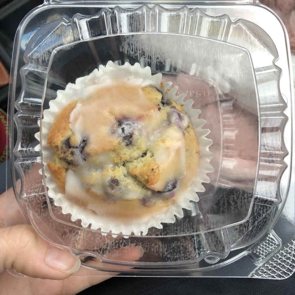 a blueberry muffin in a plastic container