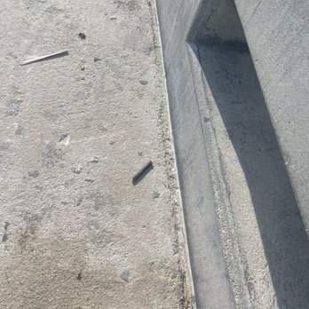 Higgs Beach - Liter on the walkway, plastic bits. - Beaches Near Me - Key West, Florida