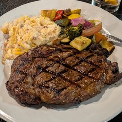 Cowboy Ranch House - 14 oz local ribeye with mashed potatoes and grilled vegetables. Fantastic steak and price! $34