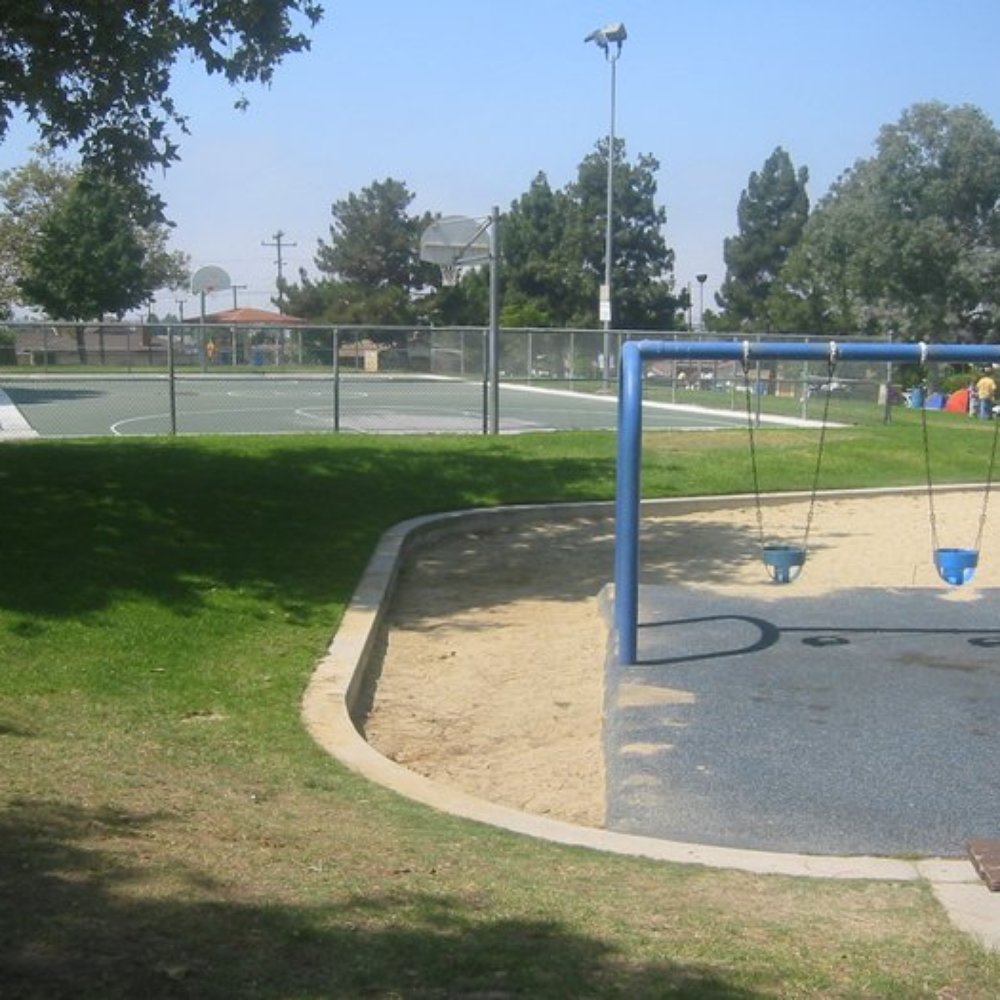 Sur La Brea Park - lighted b-ball court in the background - Parks Near Me - Torrance, California Sur La Brea Park - lighted b-ball court in the background - Parks Near Me - Torrance, California