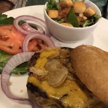 Swiss Lounge - a burger and salad on a plate - Bars Near Me - Babb, Montana