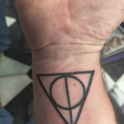 My deathly hallows tattoo by Josh Willis at Rock Ink N Roll Tattoo