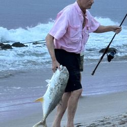 PJ’s 7 Seas Bait & Tackle - Beach walking Al smacking a huge Jack on a pj's chugging mullet