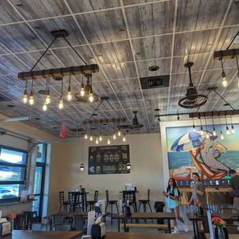 Whalehead Brewery - tables and chairs in a restaurant - Brewpubs Near Me - Corolla, North Carolina