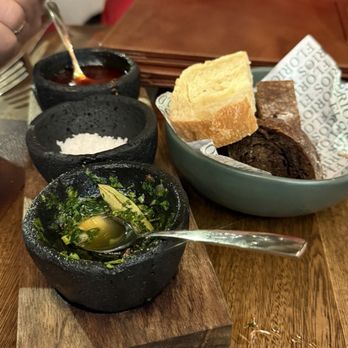 Florios - Complimentary grilled bread with  chimmichurri, salt and a spicy sauce - Italian Near Me - Puerto Vallarta, JAL