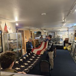 B-17 Alliance Museum & Restoration - This 1947 flag needed folding. Our teenage Civil Air patrol student led the team.