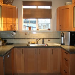 Kitchensync - Countertop is Cambria Quartz in "Bradford" and Top Knobs pulls in Meadow's Edge Square Pulls, oil-rubbed bronze, 5 7/16-inches.