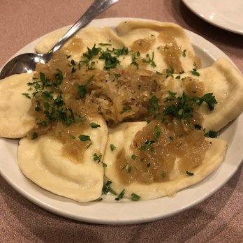 Eva's European Sweets - Potato & Cheese Pierogi topped with sautéed onions & butter and some sauerkraut - Polish Near Me - Syracuse, New York Eva's European Sweets - Potato & Cheese Pierogi topped with sautéed onions & butter and some sauerkraut - Polish Near Me - Syracuse, New York