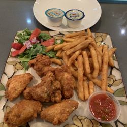 Sad salad, french fries, inexplicable salsa, breaded fried wings. Did not match the menu description. The wings were ok.