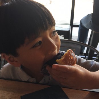 Cafe 86 - My nephew finishing the whole ube flan cupcake. - Desserts Near Me - Artesia, California