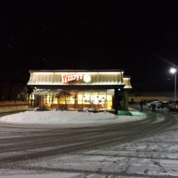 a snow covered parking lot at night a snow covered parking lot at night