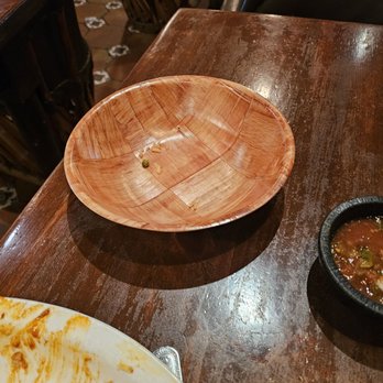 Gabriel's - Served chips out of a dirty bowl. This was what was on the bottom after I lifted the parchment paper, to take my left over chips home. - Mexican Near Me - Santa Fe, New Mexico