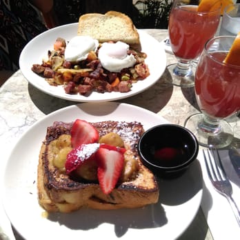 Cafe M - Cinnamon stuffed french toast mascarpone-jam filling, banana compote & Corned beef hash with poached eggs + Pomegranate mimosas - Breakfast & Brunch Near Me - Berkeley, California Cafe M - Cinnamon stuffed french toast mascarpone-jam filling, banana compote & Corned beef hash with poached eggs + Pomegranate mimosas - Breakfast & Brunch Near Me - Berkeley, California
