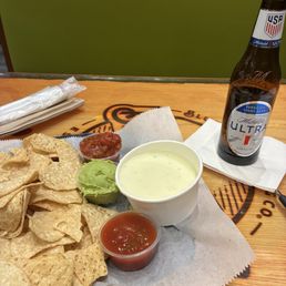 Chips with Peach Salsa as well as a white cheese sauce,