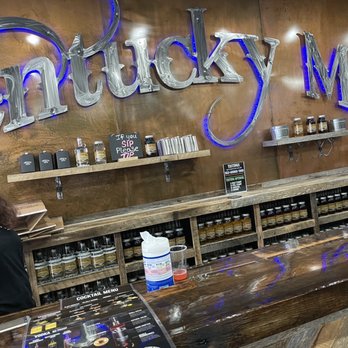 Kentucky Mist Distillery - a woman behind the counter - Distilleries Near Me - Myrtle Beach, South Carolina Kentucky Mist Distillery - a woman behind the counter - Distilleries Near Me - Myrtle Beach, South Carolina