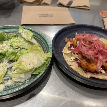 California Fish Grill - Half eaten Caesar. Great creamy dressing.  With Cajun taco. Delicious flavor, but tortilla fell apart. - Seafood Near Me - Fairfax, Virginia