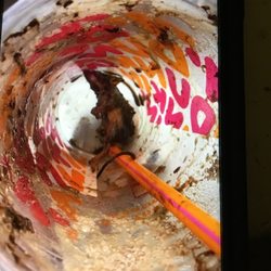 Dunkin' - My sister came to your establishment asked for a frozen caramel coffee finished it and noticed there was a mouse  in her cup