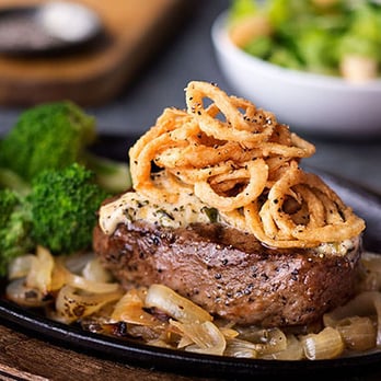 Logan's Roadhouse - Onion Brewski Sirloin: Our 8-ounce Top Sirloin stacked on beer-braised onions & topped w/ garlic butter & crispy onions. - Steakhouses Near Me - Summerville, South Carolina Logan's Roadhouse - Onion Brewski Sirloin: Our 8-ounce Top Sirloin stacked on beer-braised onions & topped w/ garlic butter & crispy onions. - Steakhouses Near Me - Summerville, South Carolina